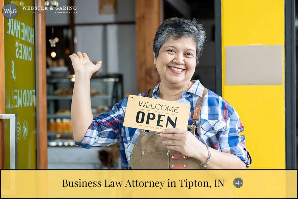 asian woman holding open sign in front of business. Business Law Attorney in Tipton, IN | Contracts & Formation
