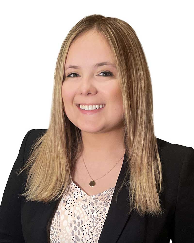 A smiling woman in a suit represents a trusted attorney at an Indiana law firm.| Webster & Garino, LLC | Indiana Law Firm serving Hamilton County