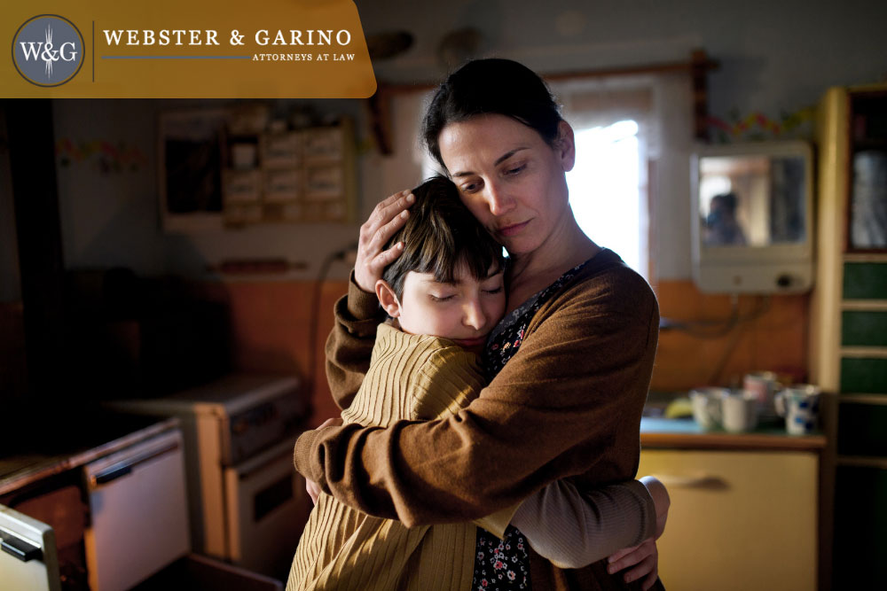 Mom comforts child after father passing.