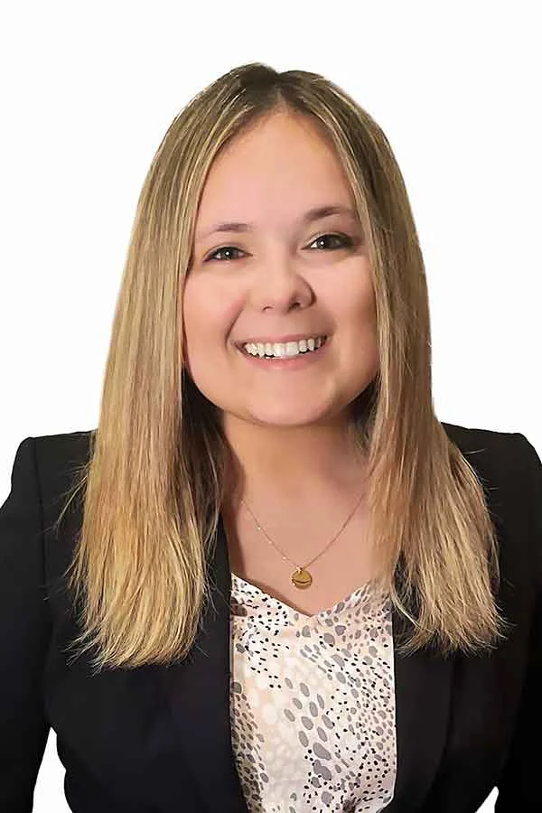 Smiling woman in a black blazer, representing a trusted Indiana law firm offering compassionate legal guidance.| Webster & Garino, LLC | Indiana Law Firm serving Hamilton County