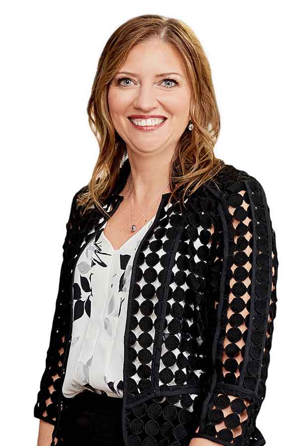 A woman in formal attire smiles, representing a professional Indiana law firm.| Webster & Garino, LLC | Indiana Law Firm serving Hamilton County