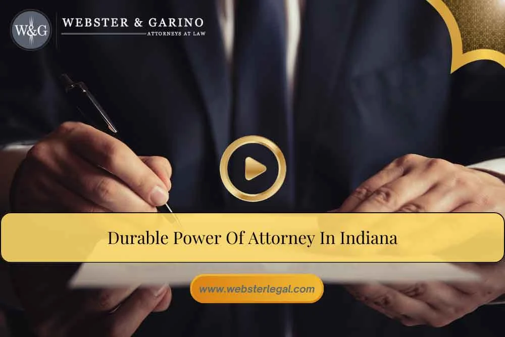 video-cover-durable-power-of-attorney Man in a suit signing documents, highlighting power of attorney services at an Indiana law firm.| Webster & Garino, LLC | Indiana Law Firm serving Hamilton County